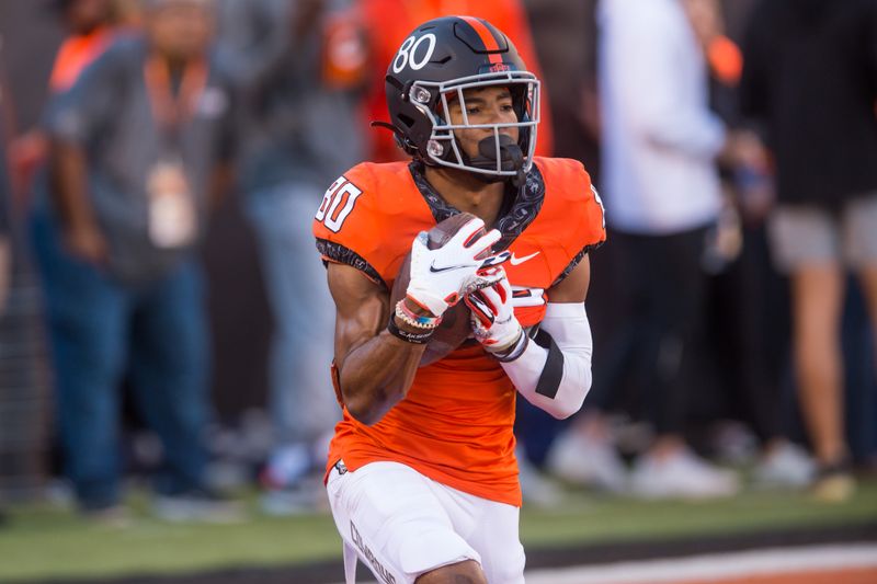 Oct 30, 2021; Stillwater, Oklahoma, USA;  Oklahoma State Cowboys wide receiver Brennan Presley (80) fields punted balls during pre game warmups before the game against the Kansas Jayhawks at Boone Pickens Stadium. Mandatory Credit: Brett Rojo-USA TODAY Sports