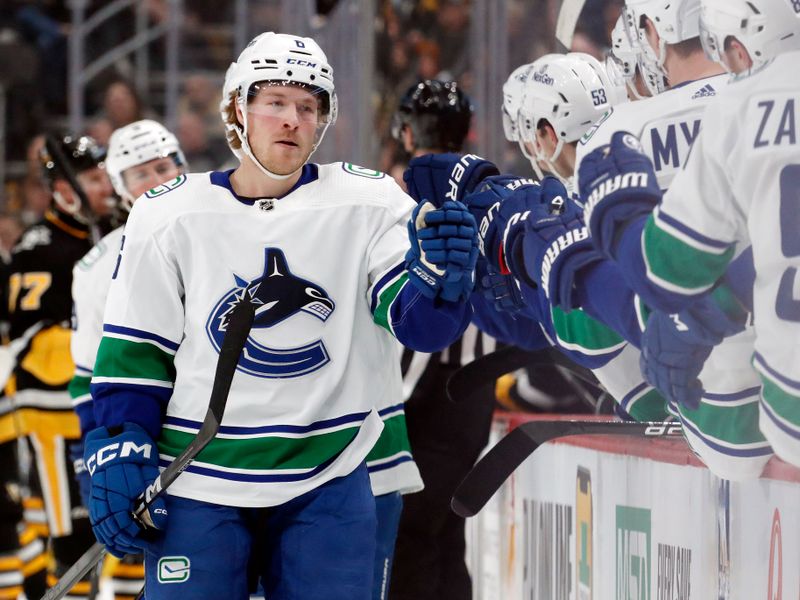 Jan 11, 2024; Pittsburgh, Pennsylvania, USA; Vancouver Canucks right wing Brock Boeser (6) celebrates with the  Canucks bench after scoring a goal against the Pittsburgh Penguins during the first period at PPG Paints Arena. Mandatory Credit: Charles LeClaire-USA TODAY Sports