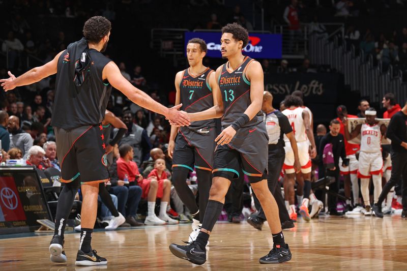 WASHINGTON, DC -? MARCH 19:  Jordan Poole #13 of the Washington Wizards high fives teammate during the game against the Houston Rockets on March 19, 2024 at Capital One Arena in Washington, DC. NOTE TO USER: User expressly acknowledges and agrees that, by downloading and or using this Photograph, user is consenting to the terms and conditions of the Getty Images License Agreement. Mandatory Copyright Notice: Copyright 2024 NBAE (Photo by Stephen Gosling/NBAE via Getty Images)