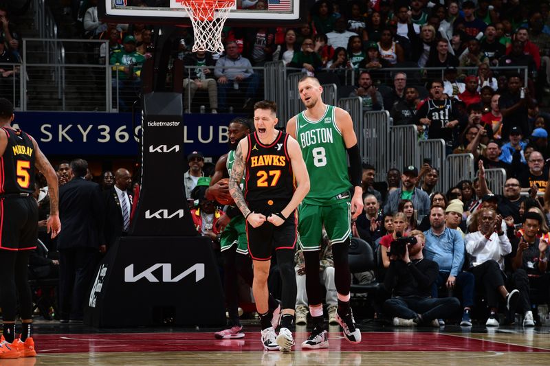 ATLANTA, GA - MARCH 28:  Vit Krejci #27 of the Atlanta Hawks celebrates during the game against the Boston Celtics on March 28, 2024 at State Farm Arena in Atlanta, Georgia.  NOTE TO USER: User expressly acknowledges and agrees that, by downloading and/or using this Photograph, user is consenting to the terms and conditions of the Getty Images License Agreement. Mandatory Copyright Notice: Copyright 2024 NBAE (Photo by Scott Cunningham/NBAE via Getty Images)