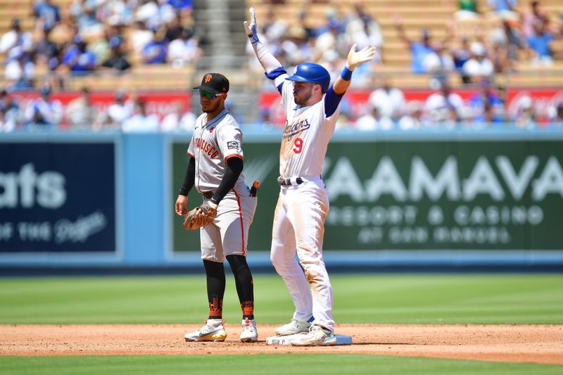 Jul 25, 2024; Los Angeles, California, USA; Los Angeles Dodgers second baseman Gavin Lux (9) reacts after reaching second on a double against the San Francisco Giants during the fourth inning at Dodger Stadium. Mandatory Credit: Gary A. Vasquez-USA TODAY Sports