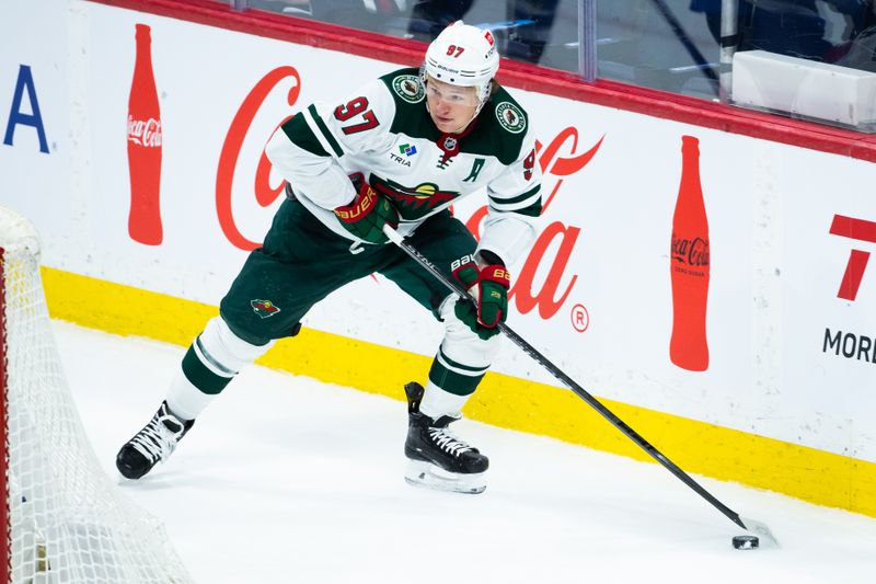 Feb 20, 2024; Winnipeg, Manitoba, CAN; Minnesota Wild forward Kirill Kaprizov (97) skates behind the Winnipeg Jets net during third period at Canada Life Centre. Mandatory Credit: Terrence Lee-USA TODAY Sports