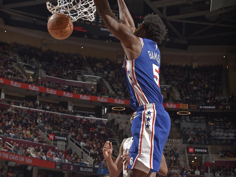 CLEVELAND, OH - MARCH 29: Mo Bamba #5 of the Philadelphia 76ers dunks the ball during the game against the Cleveland Cavaliers on March 29, 2024 at Rocket Mortgage FieldHouse in Cleveland, Ohio. NOTE TO USER: User expressly acknowledges and agrees that, by downloading and/or using this Photograph, user is consenting to the terms and conditions of the Getty Images License Agreement. Mandatory Copyright Notice: Copyright 2024 NBAE (Photo by David Liam Kyle/NBAE via Getty Images)