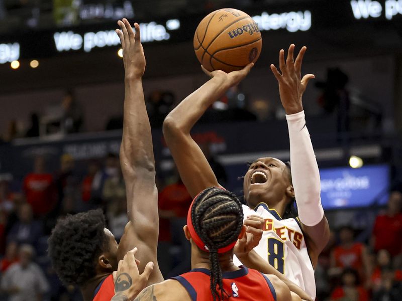 NEW ORLEANS, LOUISIANA - NOVEMBER 15:  Peyton Watson #8 of the Denver Nuggets shoots over Yves Missi #21 of the New Orleans Pelicans and Brandon Boston Jr. #11 during the first half of an Emirates NBA Cup game at the Smoothie King Center on November 15, 2024 in New Orleans, Louisiana. NOTE TO USER: User expressly acknowledges and agrees that, by downloading and or using this photograph, User is consenting to the terms and conditions of the Getty Images License Agreement. (Photo by Derick E. Hingle/Getty Images)