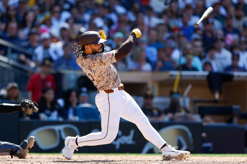 May 26, 2024; San Diego, California, USA; San Diego Padres catcher Luis Campusano (12) loses his bat as it flys towards the New York Yankees dugout in the seventh inning at Petco Park. Mandatory Credit: David Frerker-USA TODAY Sports