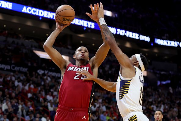 MIAMI, FLORIDA - NOVEMBER 30: Orlando Robinson #25 of the Miami Heat shoots over Bruce Brown #11 of the Indiana Pacers during the second quarter of the game at Kaseya Center on November 30, 2023 in Miami, Florida. NOTE TO USER: User expressly acknowledges and agrees that, by downloading and or using this photograph, User is consenting to the terms and conditions of the Getty Images License Agreement. (Photo by Megan Briggs/Getty Images)