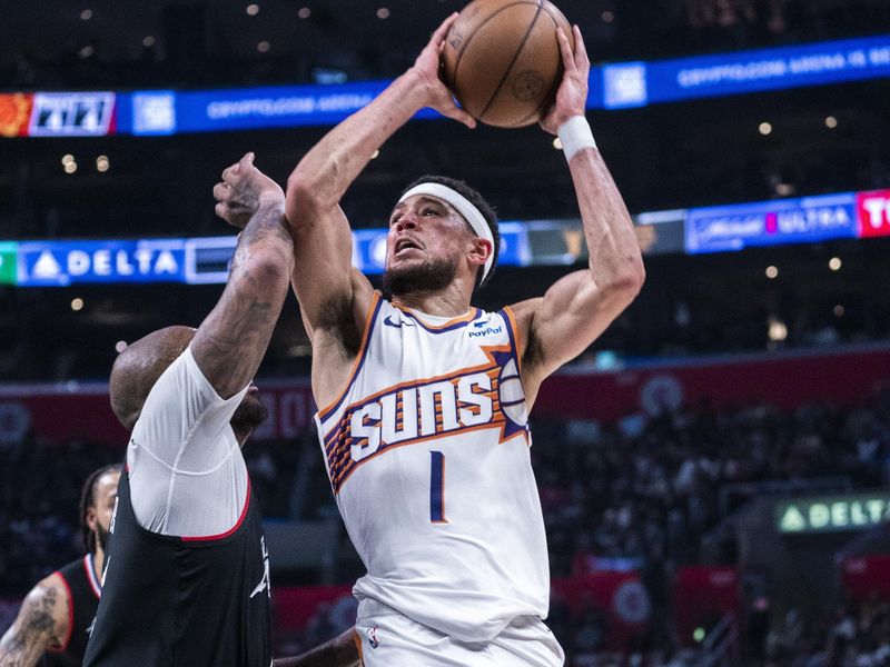 LOS ANGELES, CA - APRIL 10: Devin Booker #1 of the Phoenix Suns drives to the basket during the game against the LA Clippers on April 10, 2024 at Crypto.Com Arena in Los Angeles, California. NOTE TO USER: User expressly acknowledges and agrees that, by downloading and/or using this Photograph, user is consenting to the terms and conditions of the Getty Images License Agreement. Mandatory Copyright Notice: Copyright 2024 NBAE (Photo by Tyler Ross/NBAE via Getty Images)