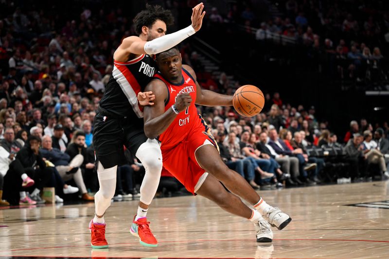 PORTLAND, OREGON - APRIL 09: Zion Williamson #1 of the New Orleans Pelicans dribbles against Justin Minaya #24 of the Portland Trail Blazers during the third quarter of the game at the Moda Center on April 09, 2024 in Portland, Oregon. The New Orleans Pelicans won 110-100. NOTE TO USER: User expressly acknowledges and agrees that, by downloading and or using this photograph, User is consenting to the terms and conditions of the Getty Images License Agreement. (Photo by Alika Jenner/Getty Images)