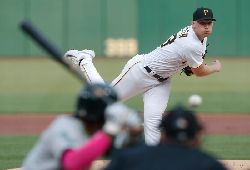 Jun 6, 2023; Pittsburgh, Pennsylvania, USA;  Pittsburgh Pirates starting pitcher Mitch Keller (23) delivers a pitch against Oakland Athletics center fielder Esteury Ruiz (1) during the first inning at PNC Park. Mandatory Credit: Charles LeClaire-USA TODAY Sports