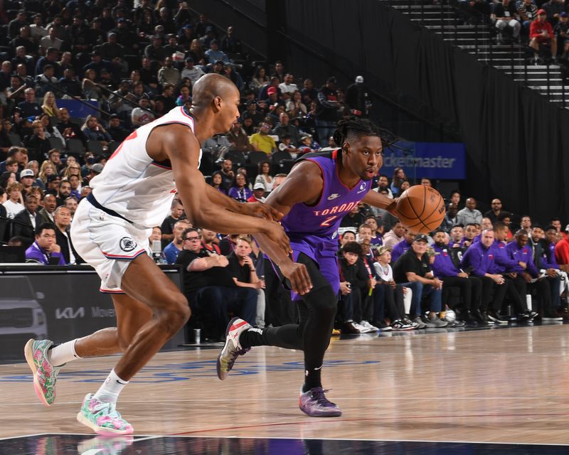 INGLEWOOD, CA - NOVEMBER 9: Jonathan Mogbo #2 of the Toronto Raptors dribbles the ball during the game against the LA Clippers on November 9, 2024 at Intuit Dome in Los Angeles, California. NOTE TO USER: User expressly acknowledges and agrees that, by downloading and/or using this Photograph, user is consenting to the terms and conditions of the Getty Images License Agreement. Mandatory Copyright Notice: Copyright 2024 NBAE (Photo by Noah Graham/NBAE via Getty Images)