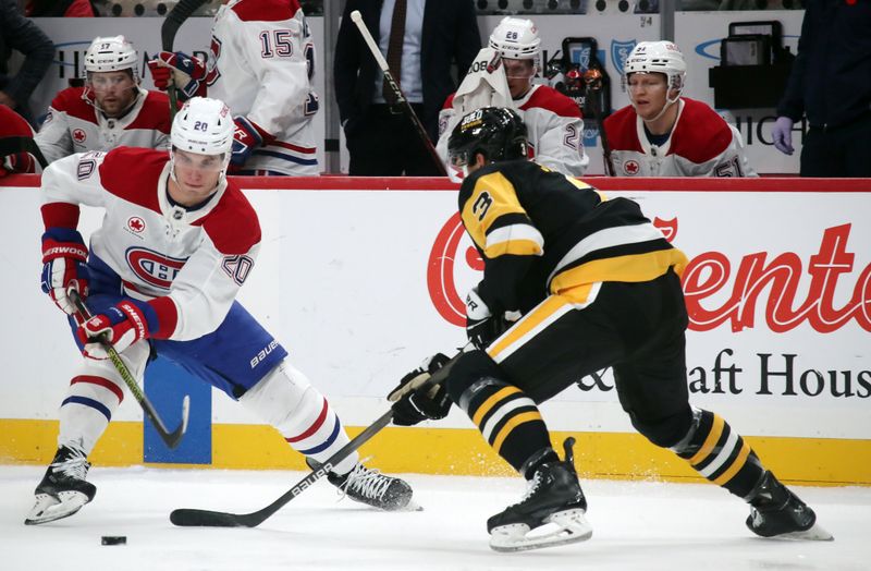 Nov 2, 2024; Pittsburgh, Pennsylvania, USA;  Montreal Canadiens left wing Juraj Slafkovsky (20) skates with the puck as Pittsburgh Penguins defenseman Jack St. Ivany (3) defends during the second period at PPG Paints Arena. Mandatory Credit: Charles LeClaire-Imagn Images