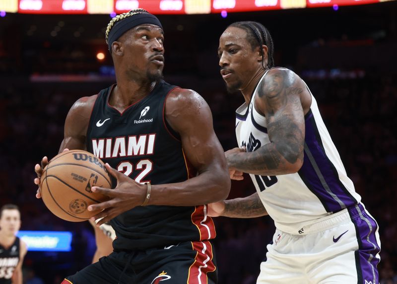 MIAMI, FLORIDA - NOVEMBER 04: Jimmy Butler #22 of the Miami Heat controls the ball against DeMar DeRozan #10 of the Sacramento Kings during the second half at Kaseya Center on November 04, 2024 in Miami, Florida. NOTE TO USER: User expressly acknowledges and agrees that, by downloading and or using this Photograph, user is consenting to the terms and conditions of the Getty Images License Agreement. (Photo by Carmen Mandato/Getty Images)