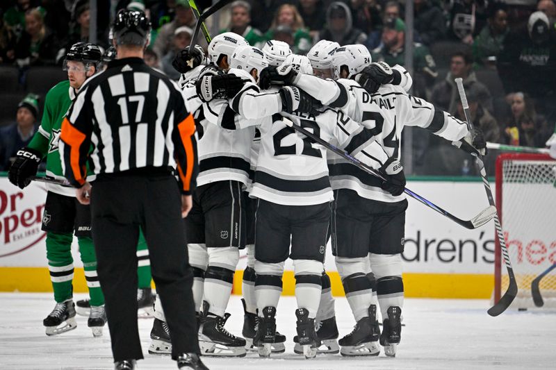 Jan 16, 2024; Dallas, Texas, USA; Los Angeles Kings right wing Quinton Byfield (55) and defenseman Drew Doughty (8) and left wing Kevin Fiala (22) and center Phillip Danault (24) and center Anze Kopitar (11) celebrates a power play goal scored by Doughty against the Dallas Stars during the second period at the American Airlines Center. Mandatory Credit: Jerome Miron-USA TODAY Sports