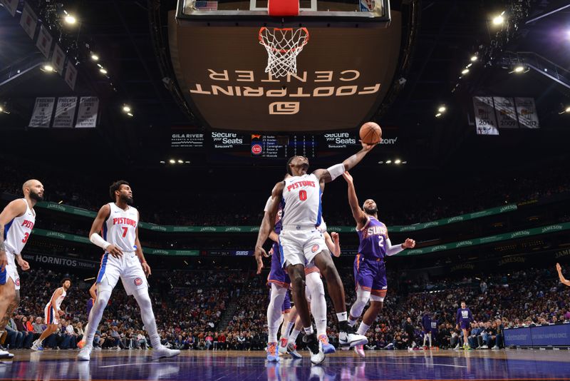 PHOENIX, AZ - FEBRUARY 14:  Jalen Duren #0 of the Detroit Pistons grabs a rebound during the game against the Phoenix Suns on February 14, 2024 at Footprint Center in Phoenix, Arizona. NOTE TO USER: User expressly acknowledges and agrees that, by downloading and or using this photograph, user is consenting to the terms and conditions of the Getty Images License Agreement. Mandatory Copyright Notice: Copyright 2024 NBAE (Photo by Barry Gossage/NBAE via Getty Images)