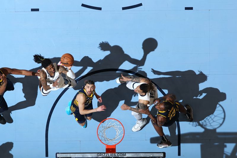 MEMPHIS, TN - JANUARY 29: Ja Morant #12 of the Memphis Grizzlies drives to the basket during the game against the Indiana Pacers on January 29, 2023 at FedExForum in Memphis, Tennessee. NOTE TO USER: User expressly acknowledges and agrees that, by downloading and or using this photograph, User is consenting to the terms and conditions of the Getty Images License Agreement. Mandatory Copyright Notice: Copyright 2023 NBAE (Photo by Joe Murphy/NBAE via Getty Images)