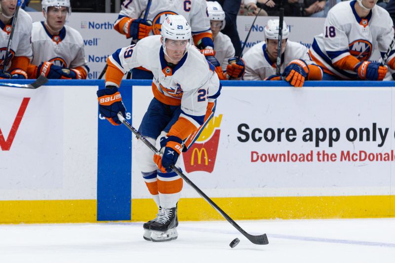 Oct 30, 2023; Elmont, New York, USA; New York Islanders center Brock Nelson (29) moves the puck against the Detroit Red Wings during the second period at UBS Arena. Mandatory Credit: Thomas Salus-USA TODAY Sports