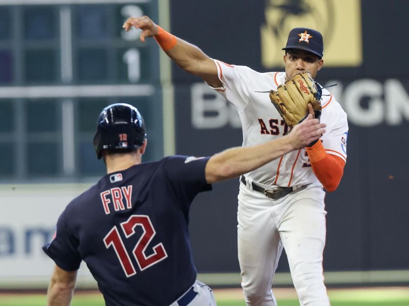 Aug 2, 2023; Houston, Texas, USA; Houston Astros shortstop Jeremy Pena (3) forces Cleveland Guardians first baseman David Fry (12) out at second base and turns a double play in the eighth inning at Minute Maid Park. Mandatory Credit: Thomas Shea-USA TODAY Sports