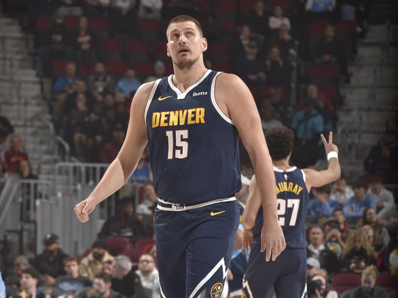 CLEVELAND, OH - DECEMBER 8: Nikola Jokic #15 of the Denver Nuggets looks on during the game against the Cleveland Cavaliers on December 5, 2024 at Rocket Mortgage FieldHouse in Cleveland, Ohio. NOTE TO USER: User expressly acknowledges and agrees that, by downloading and/or using this Photograph, user is consenting to the terms and conditions of the Getty Images License Agreement. Mandatory Copyright Notice: Copyright 2024 NBAE (Photo by David Liam Kyle/NBAE via Getty Images)