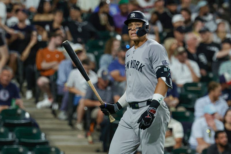 Aug 13, 2024; Chicago, Illinois, USA; New York Yankees outfielder Aaron Judge (99) reacts after striking out against the Chicago White Sox during the fifth inning at Guaranteed Rate Field. Mandatory Credit: Kamil Krzaczynski-USA TODAY Sports