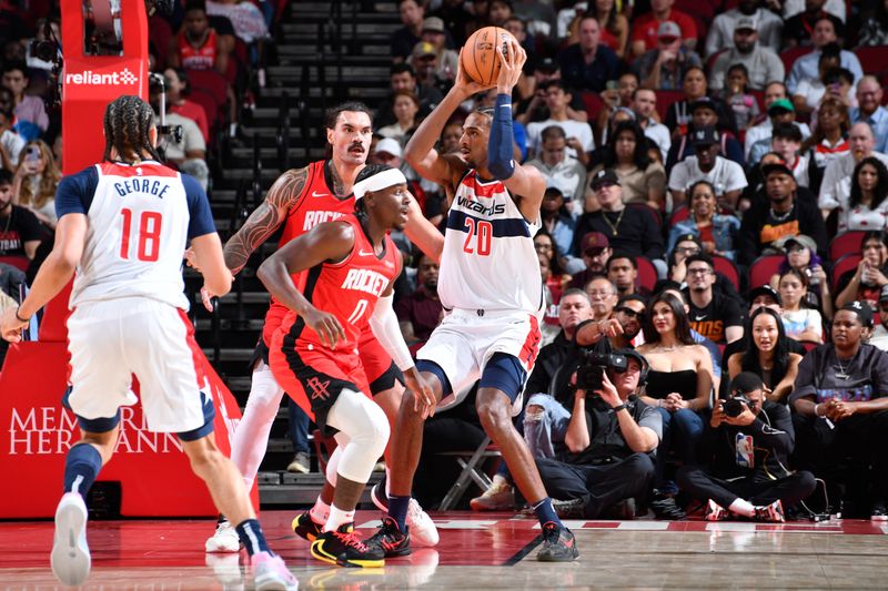 HOUSTON, TX - NOVEMBER 11: Alexandre Sarr #20 of the Washington Wizards handles the ball during the game against the Houston Rockets on November 11, 2024 at the Toyota Center in Houston, Texas. NOTE TO USER: User expressly acknowledges and agrees that, by downloading and or using this photograph, User is consenting to the terms and conditions of the Getty Images License Agreement. Mandatory Copyright Notice: Copyright 2024 NBAE (Photo by Logan Riely/NBAE via Getty Images)