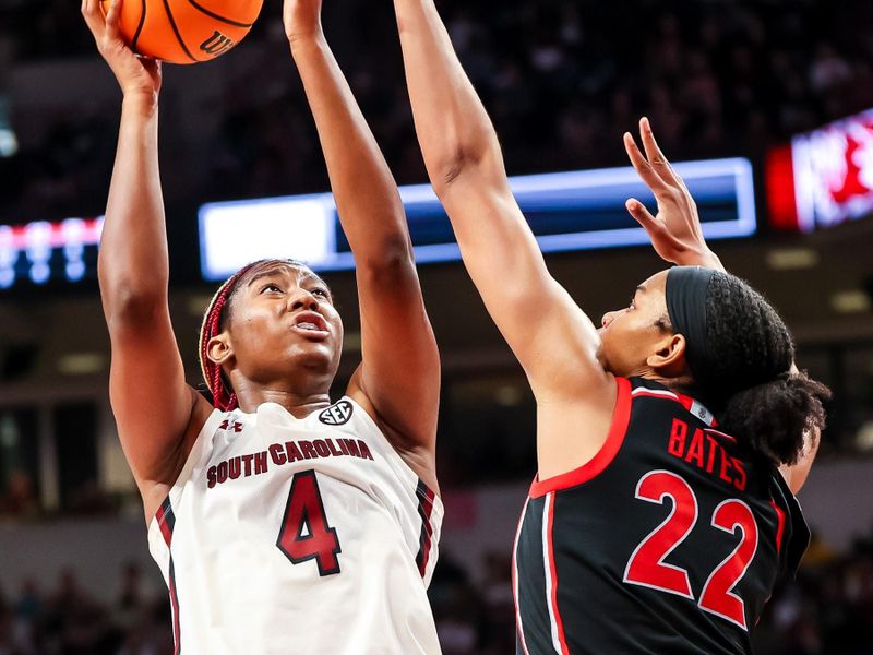 Feb 26, 2023; Columbia, South Carolina, USA; South Carolina Gamecocks forward Aliyah Boston (4) shoots over Georgia Lady Bulldogs forward Malury Bates (22) in the second half at Colonial Life Arena. Mandatory Credit: Jeff Blake-USA TODAY Sports