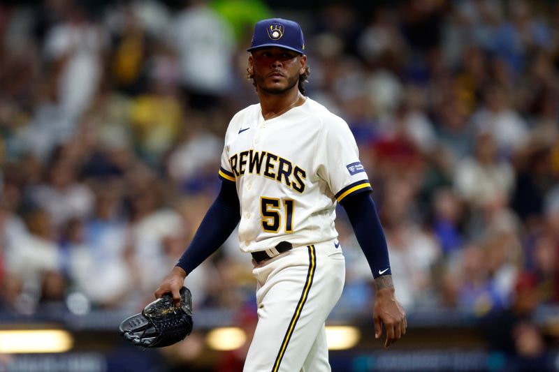 Oct 4, 2023; Milwaukee, Wisconsin, USA; Milwaukee Brewers starting pitcher Freddy Peralta (51) leaves the mound in the sixth inning against the Arizona Diamondbacks during game two of the Wildcard series for the 2023 MLB playoffs at American Family Field. Mandatory Credit: Kamil Krzaczynski-USA TODAY Sports