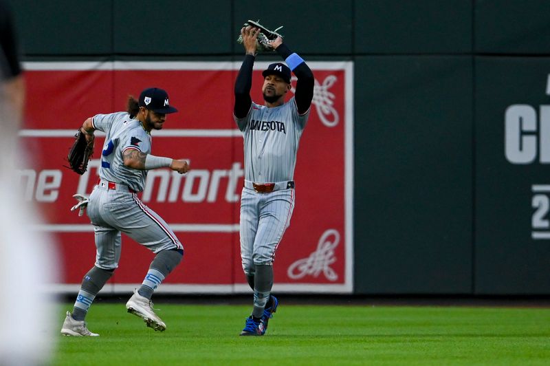 Apr 15, 2024; Baltimore, Maryland, USA; Minnesota Twins outfielder Byron Buxton catches a third inning fly ball in front of outfielder Auston Martin against the Baltimore Orioles  at Oriole Park at Camden Yards. Mandatory Credit: Tommy Gilligan-USA TODAY Sports