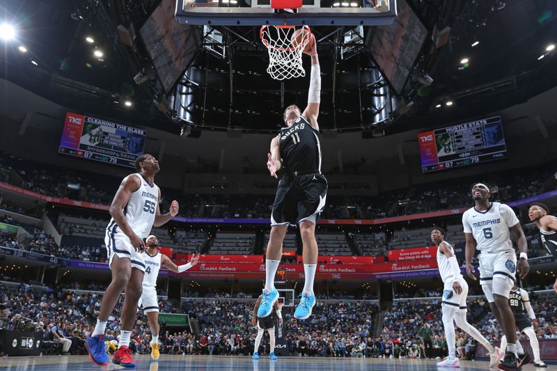 MEMPHIS, TN - FEBRUARY 15: Brook Lopez #11 of the Milwaukee Bucks dunks the ball during the game against the Memphis Grizzlies on February 15, 2024 at FedExForum in Memphis, Tennessee. NOTE TO USER: User expressly acknowledges and agrees that, by downloading and or using this photograph, User is consenting to the terms and conditions of the Getty Images License Agreement. Mandatory Copyright Notice: Copyright 2024 NBAE (Photo by Stephen Gosling/NBAE via Getty Images)