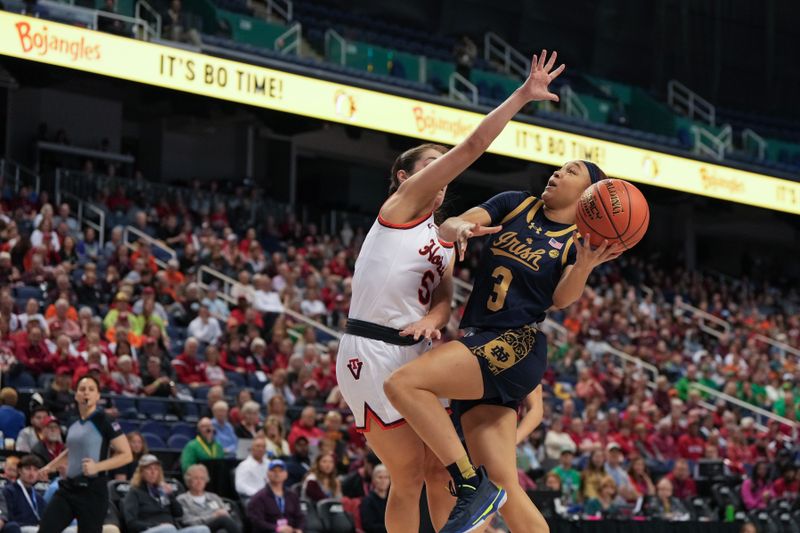 Mar 9, 2024; Greensboro, NC, USA; Notre Dame Fighting Irish guard Hannah Hidalgo (3) shoots the ball over Notre Dame Fighting Irish guard Olivia Miles (5) during the second half at Greensboro Coliseum. Mandatory Credit: David Yeazell-USA TODAY Sports