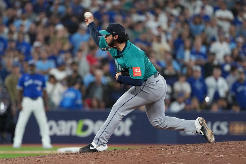 Oct 12, 2025; Toronto, Ontario, CAN; Seattle Mariners pitcher Andrés Muñoz (75) throws to the plate in the ninth inning against the Toronto Blue Jays during game one of the ALCS round for the 2025 MLB playoffs at Rogers Centre. Mandatory Credit: Nick Turchiaro-Imagn Images