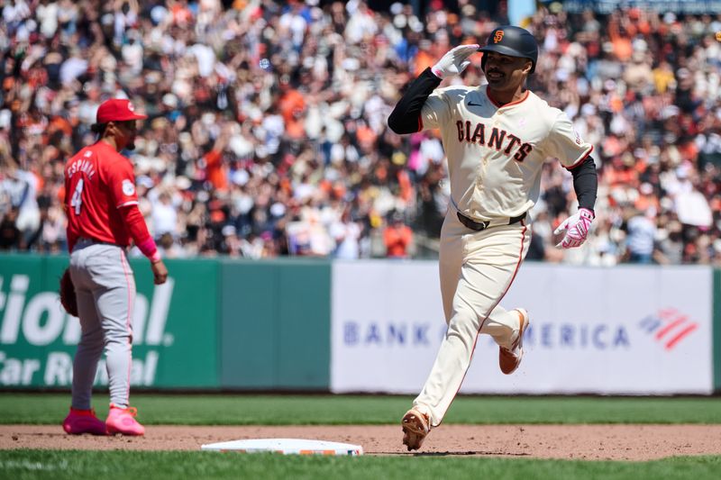 May 12, 2024; San Francisco, California, USA; San Francisco Giants infielder LaMonte Wade Jr. (31) salutes the Giants dugout after hitting a two run home run against the Cincinnati Reds during the fifth inning at Oracle Park. Mandatory Credit: Robert Edwards-USA TODAY Sports