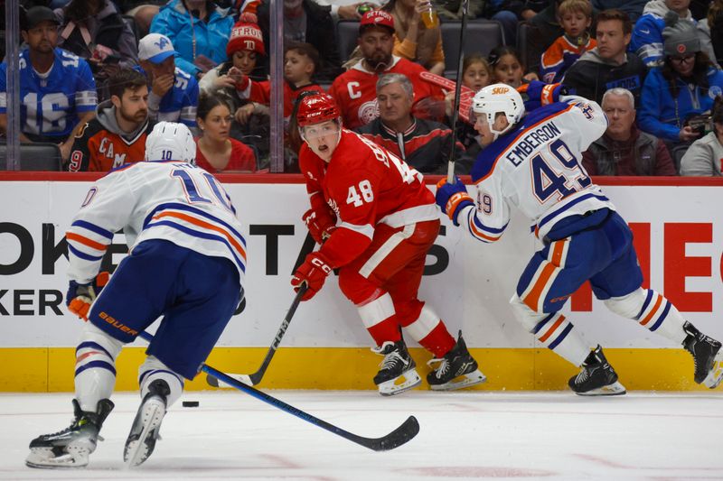 Oct 27, 2024; Detroit, Michigan, USA; Detroit Red Wings right wing Jonatan Berggren (48) handles the puck during the second period of the game against the Edmonton Oilers at Little Caesars Arena. Mandatory Credit: Brian Bradshaw Sevald-Imagn Images