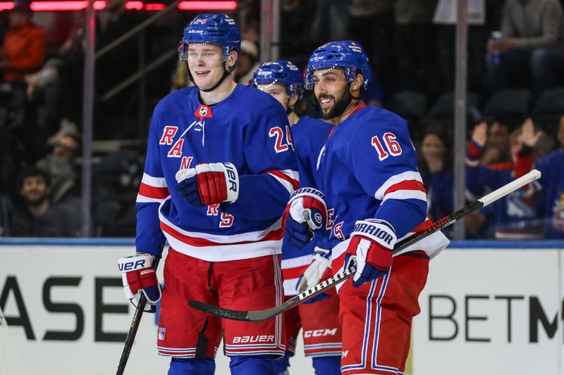 Sep 26, 2023; New York, New York, USA;  New York Rangers right wing Kaapo Kakko (24) celebrates with his teammates after scoring a goal in the first period against the New York Islanders at Madison Square Garden. Mandatory Credit: Wendell Cruz-USA TODAY Sports