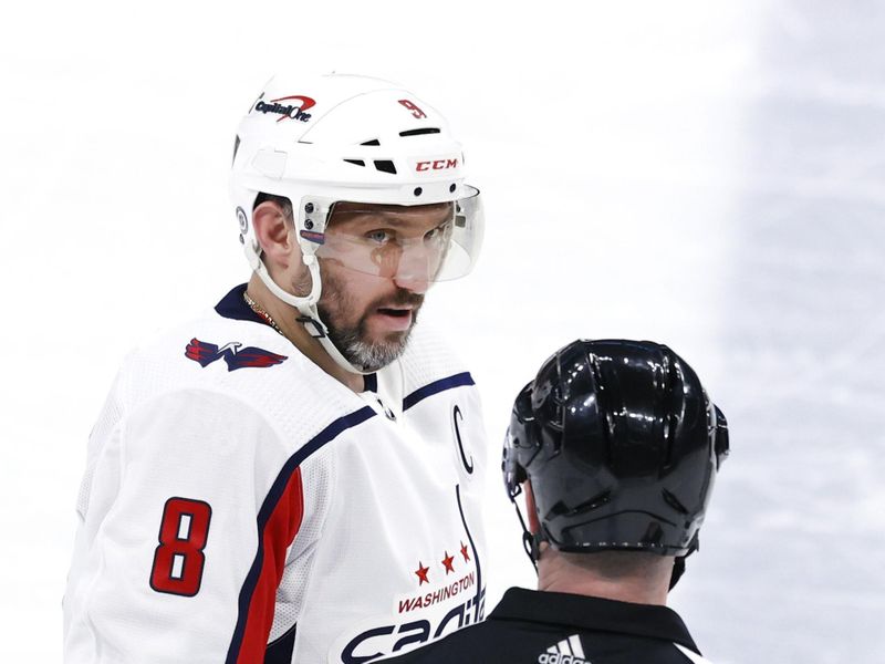 Mar 11, 2024; Winnipeg, Manitoba, CAN; Washington Capitals left wing Alex Ovechkin (8) talks with referee Mitch Dunning (20) in the third period against the Winnipeg Jets at Canada Life Centre. Mandatory Credit: James Carey Lauder-USA TODAY Sports