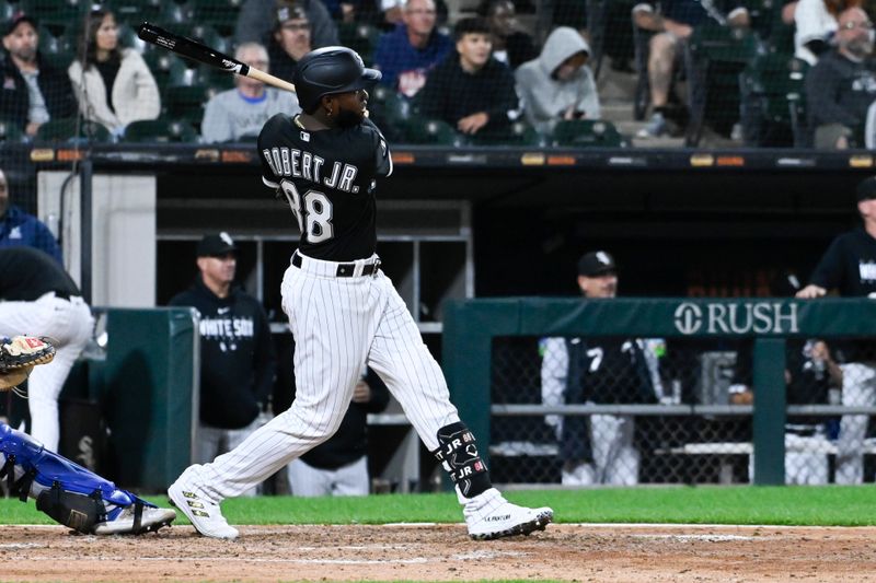 Sep 12, 2023; Chicago, Illinois, USA; Chicago White Sox center fielder Luis Robert Jr. (88) hits an RBI single against the Kansas City Royals during the sixth inning at Guaranteed Rate Field. Mandatory Credit: Matt Marton-USA TODAY Sports