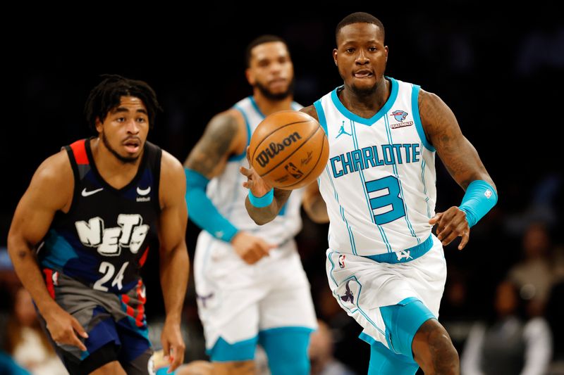 NEW YORK, NEW YORK - NOVEMBER 30: Terry Rozier #3 of the Charlotte Hornets dribbles as Cam Thomas #24 of the Brooklyn Nets defends during the first half at Barclays Center on November 30, 2023 in the Brooklyn borough of New York City. NOTE TO USER: User expressly acknowledges and agrees that, by downloading and/or using this Photograph, user is consenting to the terms and conditions of the Getty Images License Agreement. (Photo by Sarah Stier/Getty Images)