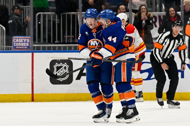 Mar 14, 2026; Elmont, New York, USA; New York Islanders right wing Simon Holmstrom (92) celebrates his second goal against the Calgary Flames with New York Islanders center Jean-Gabriel Pageau (44) during the first period at UBS Arena. Mandatory Credit: Dennis Schneidler-Imagn Images Mar 14, 2026; Elmont, New York, USA; New York Islanders right wing Simon Holmstrom (92) celebrates his second goal against the Calgary Flames with New York Islanders center Jean-Gabriel Pageau (44) during the first period at UBS Arena. Mandatory Credit: Dennis Schneidler-Imagn Images
