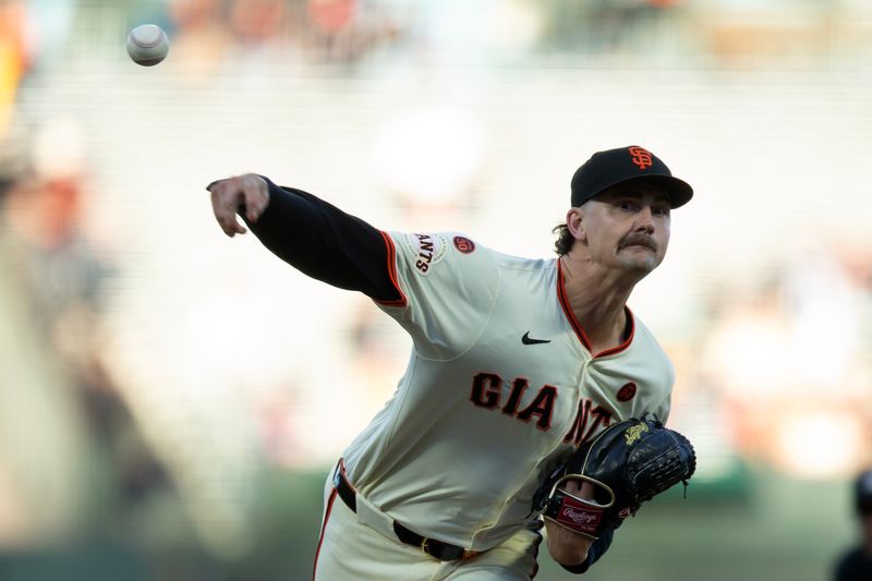 Aug 14, 2024; San Francisco, California, USA; San Francisco Giants pitcher Sean Hjelle (64) delivers a pitch against the Atlanta Braves during the first inning at Oracle Park. Mandatory Credit: D. Ross Cameron-USA TODAY Sports