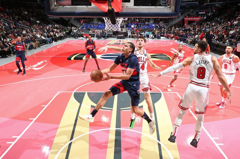 WASHINGTON, DC -? NOVEMBER 26: Kyshawn George #18 of the Washington Wizards drives to the basket during the game against the Chicago Bulls during the Emirates NBA Cup game on November 26, 2024 at Capital One Arena in Washington, DC. NOTE TO USER: User expressly acknowledges and agrees that, by downloading and or using this Photograph, user is consenting to the terms and conditions of the Getty Images License Agreement. Mandatory Copyright Notice: Copyright 2024 NBAE (Photo by Stephen Gosling/NBAE via Getty Images)