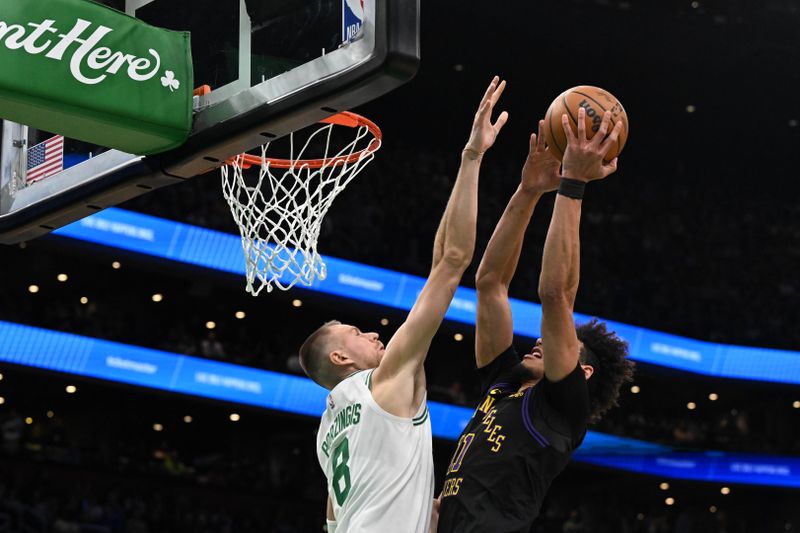 BOSTON, MASSACHUSETTS - FEBRUARY 01: Kristaps Porzingis #8 of the Boston Celtics defends Jaxson Hayes #11 of the Los Angeles Lakers during the second quarter at the TD Garden on February 01, 2024 in Boston, Massachusetts. NOTE TO USER: User expressly acknowledges and agrees that, by downloading and or using this photograph, User is consenting to the terms and conditions of the Getty Images License Agreement. (Photo by Brian Fluharty/Getty Images)