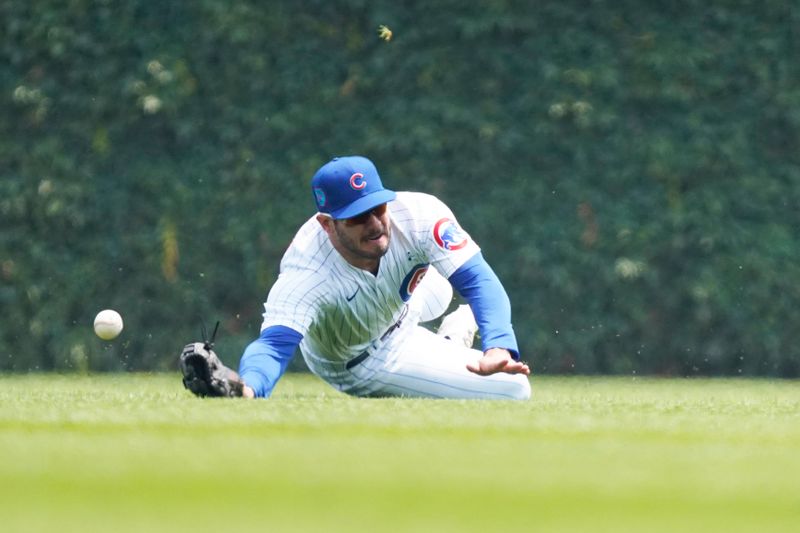 Jun 18, 2023; Chicago, Illinois, USA; Chicago Cubs center fielder Mike Tauchman (40) can t make a catch on Baltimore Orioles left fielder Austin Hays (21) during the first inning at Wrigley Field. Mandatory Credit: David Banks-USA TODAY Sports