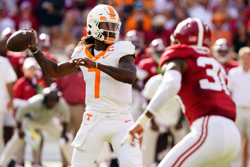 Oct 21, 2023; Tuscaloosa, Alabama, USA; Tennessee Volunteers quarterback Joe Milton III (7) passing against the Alabama Crimson Tide during the first half at Bryant-Denny Stadium. Mandatory Credit: John David Mercer-USA TODAY Sports