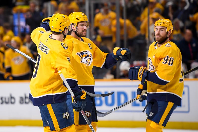 Apr 13, 2024; Nashville, Tennessee, USA; Nashville Predators defenseman Roman Josi (59) celebrates his goal against the Columbus Blue Jackets during the first period at Bridgestone Arena. Mandatory Credit: Steve Roberts-USA TODAY Sports