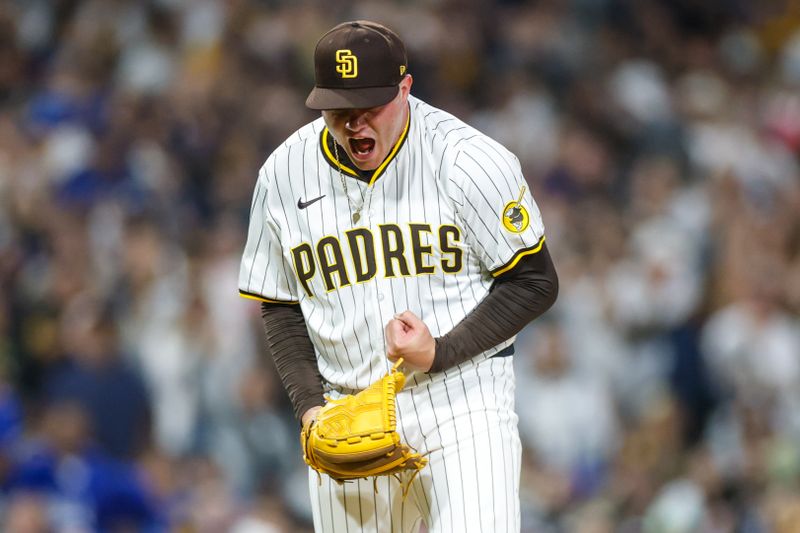 Jun 9, 2025; San Diego, California, USA; San Diego Padres relief pitcher Adrian Morejon (50) celebrates during the eighth inning against the Los Angeles Dodgers at Petco Park. Mandatory Credit: David Frerker-Imagn Images