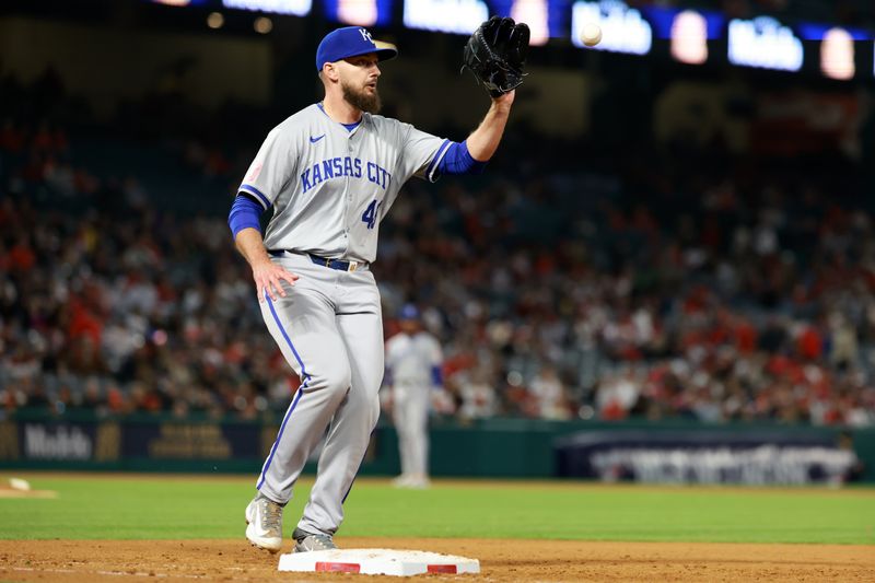 May 10, 2024; Anaheim, California, USA;  Kansas City Royals pitcher John Schreiber (46) makes a play at first during the ninth inning against the Los Angeles Angels at Angel Stadium. Mandatory Credit: Kiyoshi Mio-USA TODAY Sports