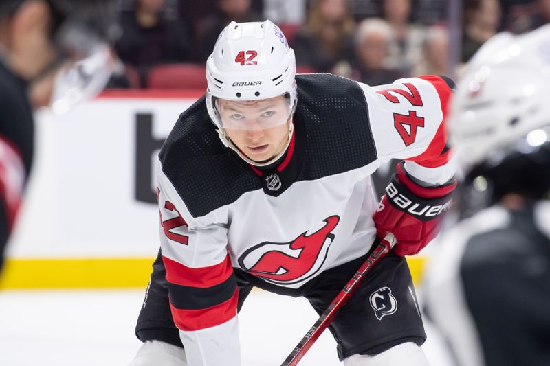 Apr 6, 2024; Ottawa, Ontario, CAN; New Jersey Devils center Curtis Lazar (42) lines up for a face off in the second period against the Ottawa Senators at the Canadian Tire Centre. Mandatory Credit: Marc DesRosiers-USA TODAY Sports