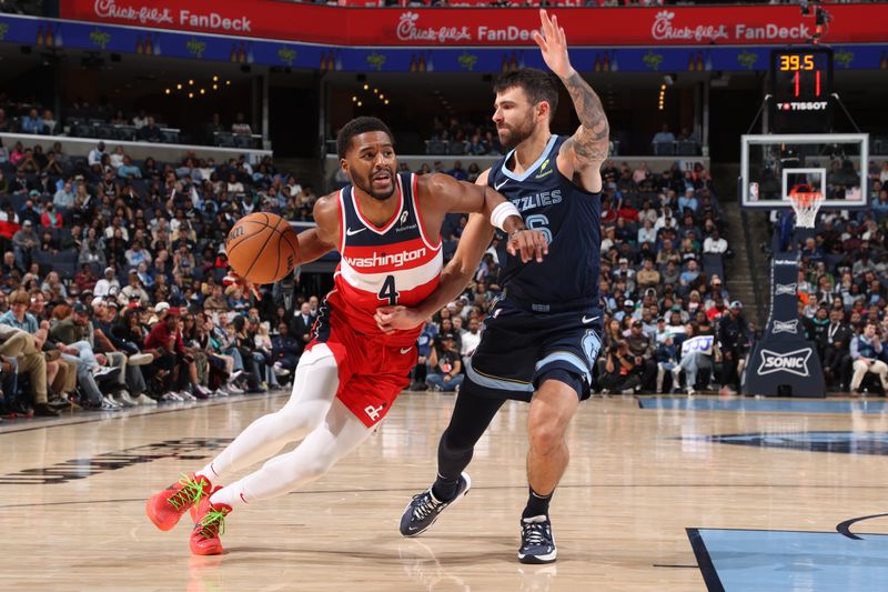 MEMPHIS, TN - NOVEMBER 8: Jared Butler #4 of the Washington Wizards drives to the basket during the game against the Memphis Grizzlies on November 8, 2024 at FedExForum in Memphis, Tennessee. NOTE TO USER: User expressly acknowledges and agrees that, by downloading and or using this photograph, User is consenting to the terms and conditions of the Getty Images License Agreement. Mandatory Copyright Notice: Copyright 2024 NBAE (Photo by Joe Murphy/NBAE via Getty Images)