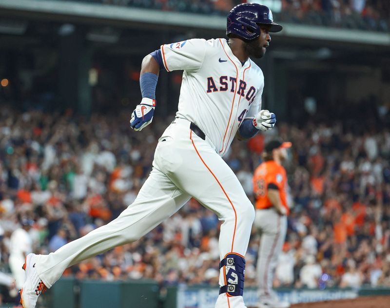 Jun 22, 2024; Houston, Texas, USA; Baltimore Orioles starting pitcher Corbin Burnes (39) reacts and Houston Astros designated hitter Yordan Alvarez (44) rounds the bases after hitting a home run during the third inning at Minute Maid Park. Mandatory Credit: Troy Taormina-USA TODAY Sports