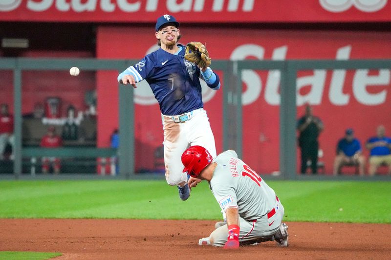 Aug 23, 2024; Kansas City, Missouri, USA; Kansas City Royals shortstop Bobby Witt Jr. (7) gets the force out at second base on Philadelphia Phillies catcher J.T. Realmuto (10) and throws to first for a double play in the seventh inning at Kauffman Stadium. Mandatory Credit: Denny Medley-USA TODAY Sports