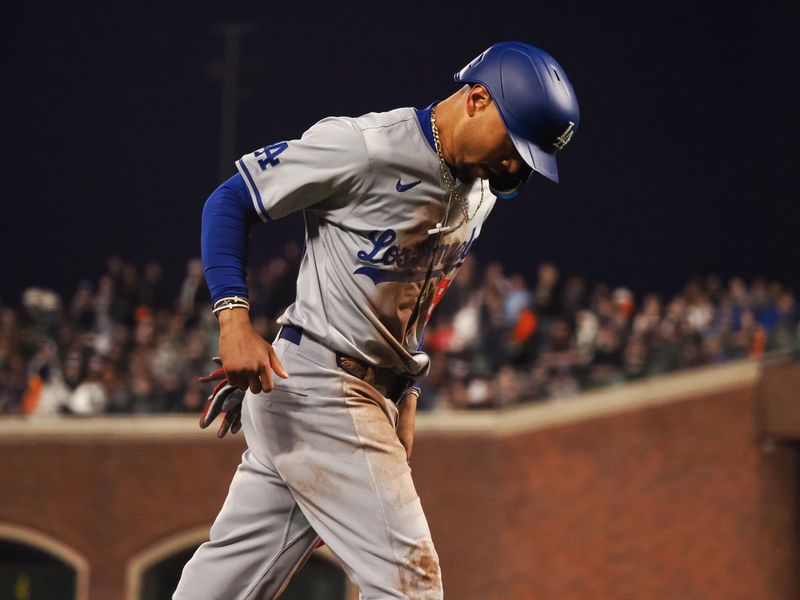 May 14, 2024; San Francisco, California, USA; Los Angeles Dodgers shortstop Mookie Betts (50) scores a run against the San Francisco Giants during the seventh inning at Oracle Park. Mandatory Credit: Kelley L Cox-USA TODAY Sports